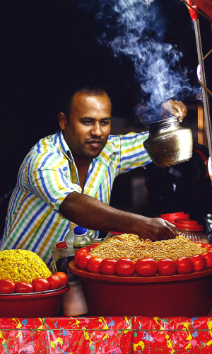 A man preparing traditional Indian food