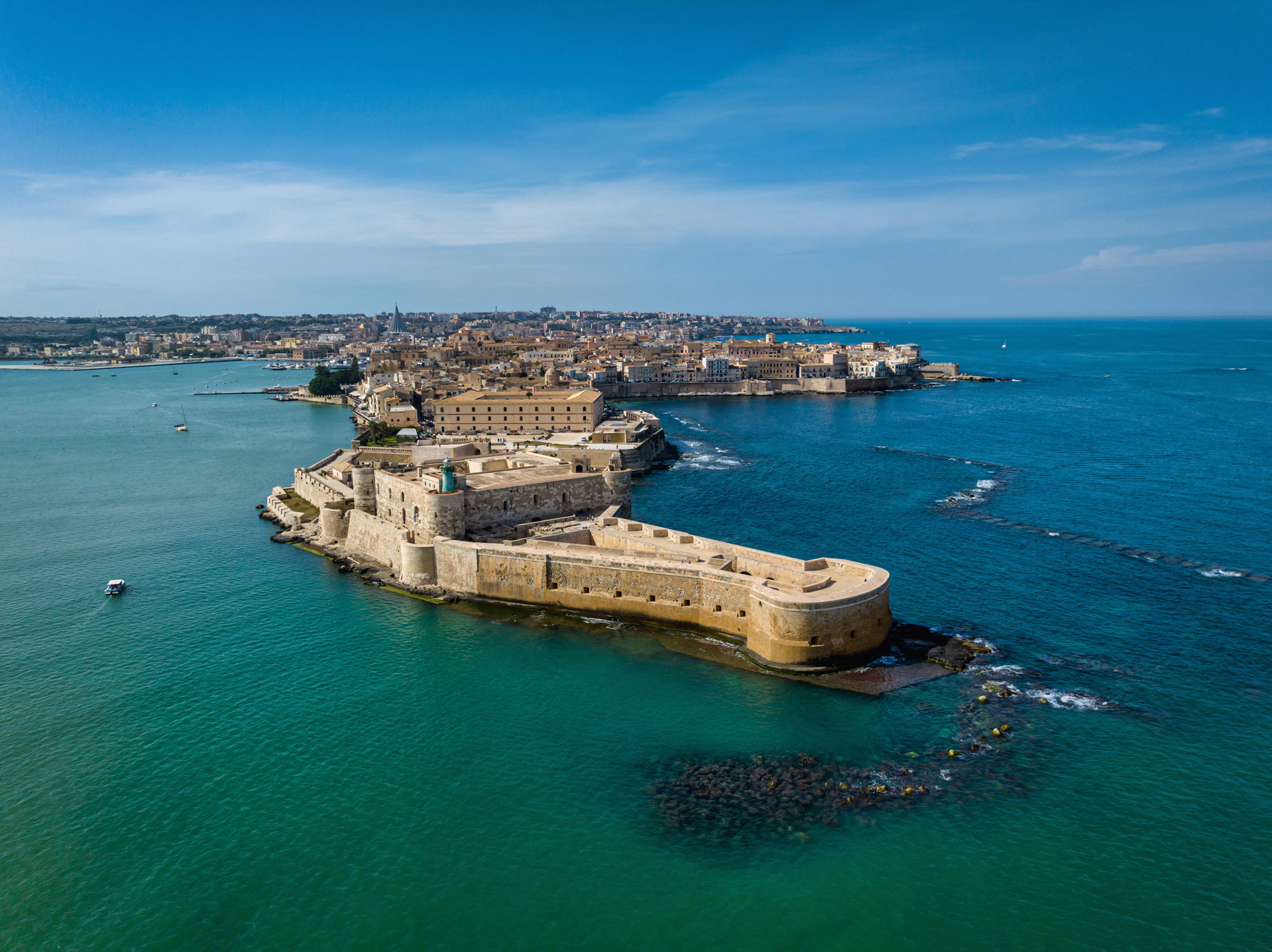 Aerial view of Ortigia Island and Siracusa city at sunset