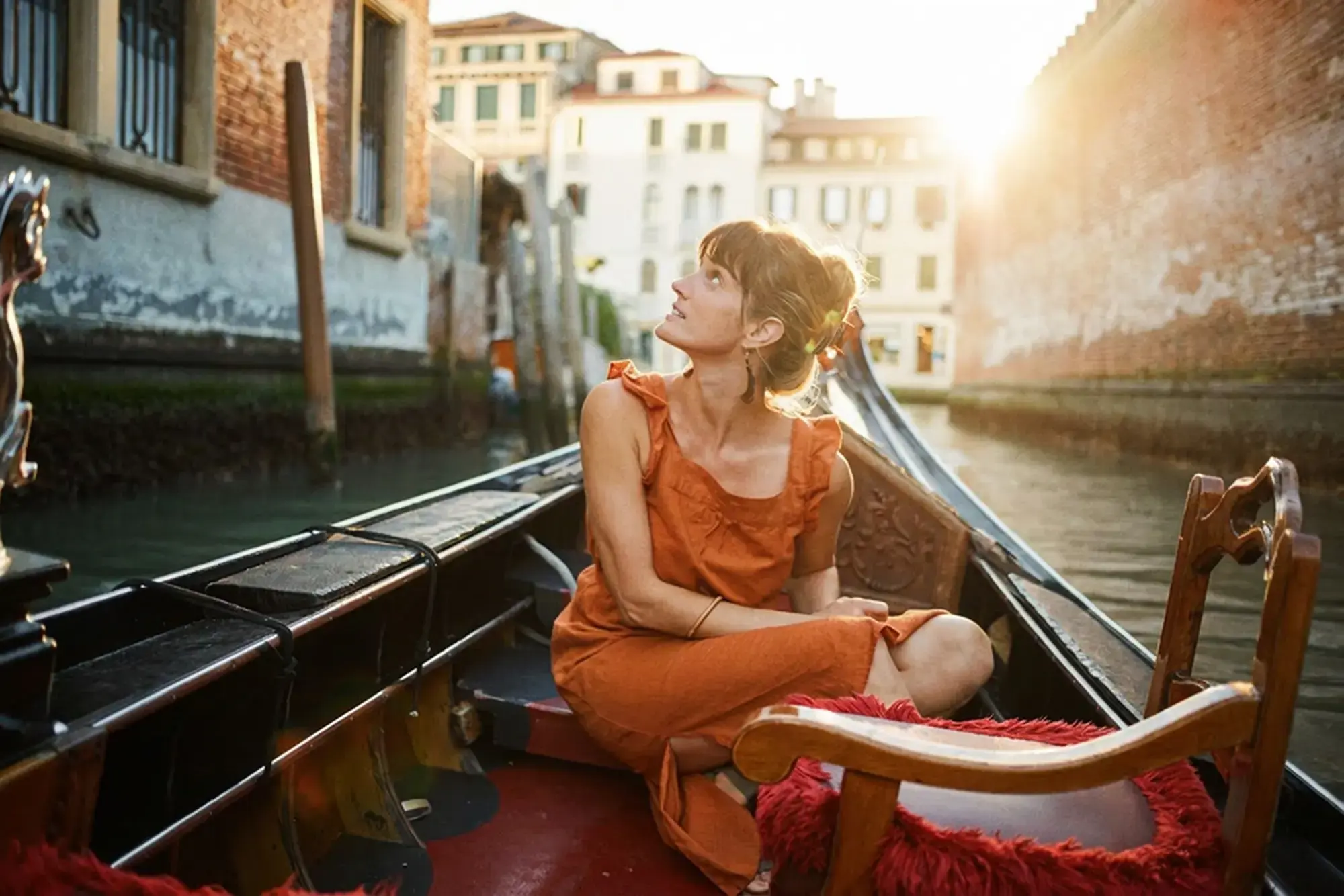 day-hero-woman-gondola-venice-italy-rtd.webp
