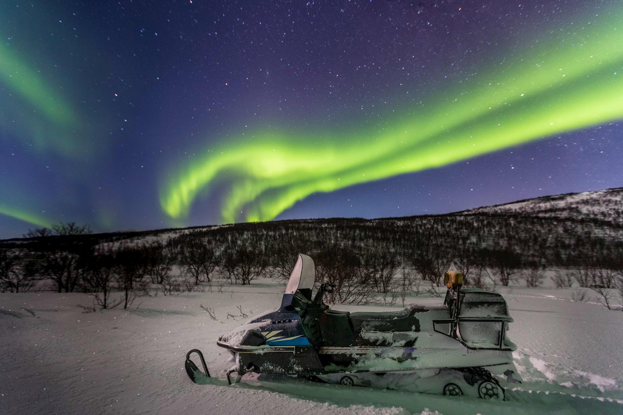 enjoy-a-snowmobile-ride-seeing-the-northern-lights-ivalo-finland.jpg