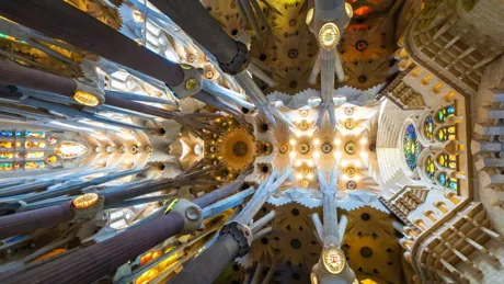 Illuminated interior of The Sagrada Familia church designed By Antoni Gaudi