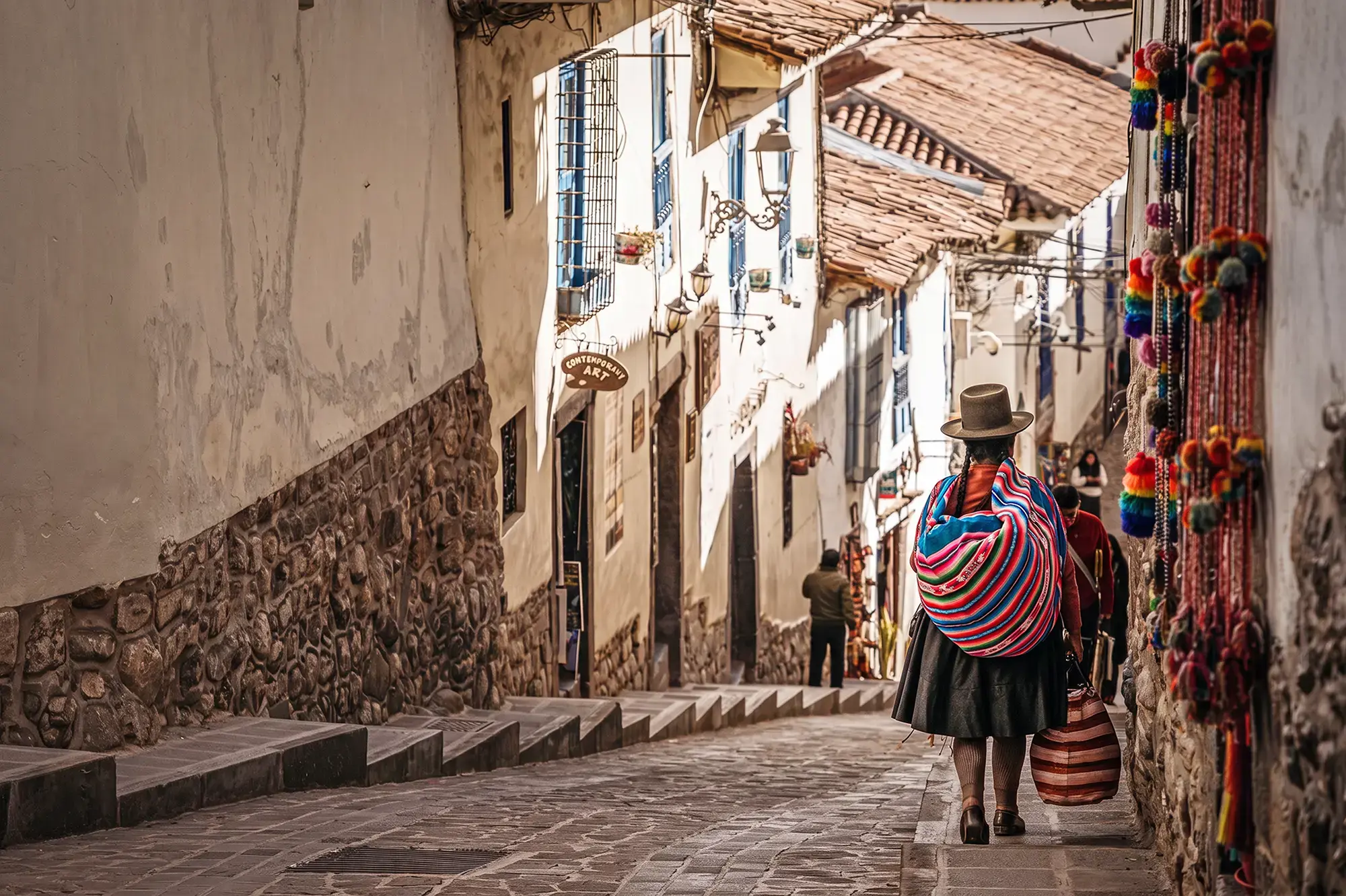 day-hero-woman-walking-on-a-steep-cobblestone-street-san-blas-peru-2252236780.webp