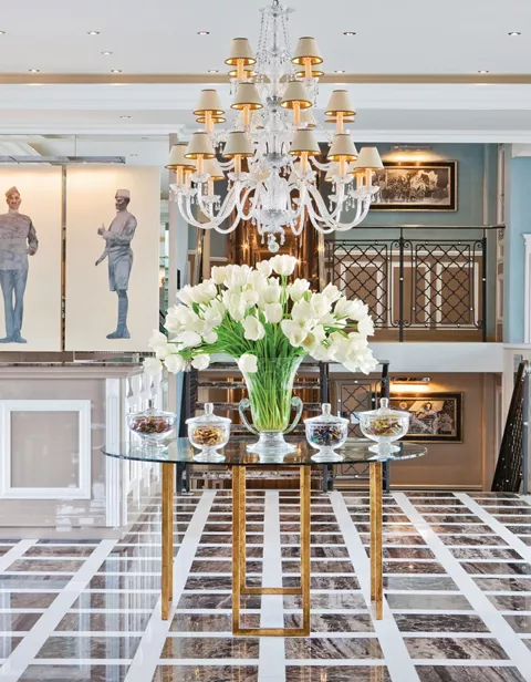 Trafalgar Harmonie flowers and chandelier in middle of lobby