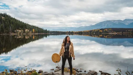 Patricia from Warrior Women standing by the lake in Jasper National Park, USA