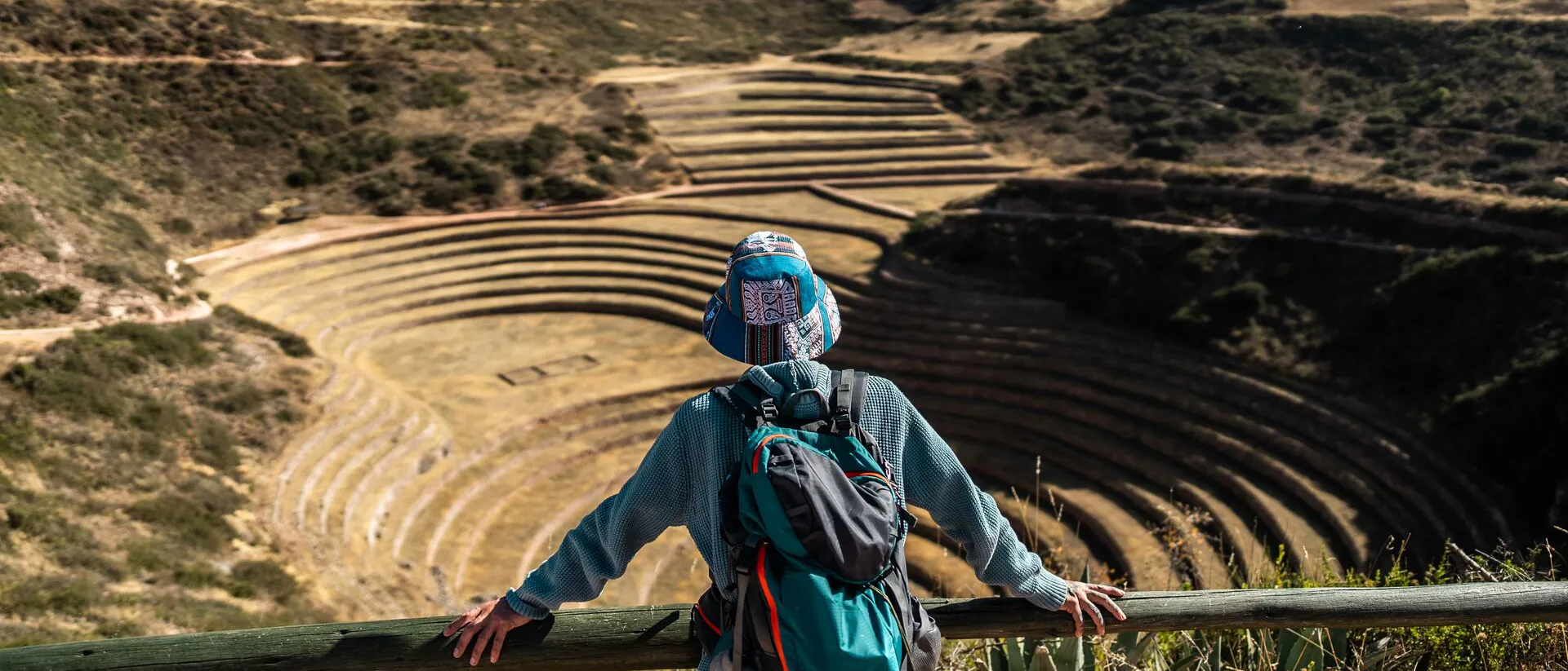 Middle-aged solo traveller enjoying beautiful views on a mountain in Peru