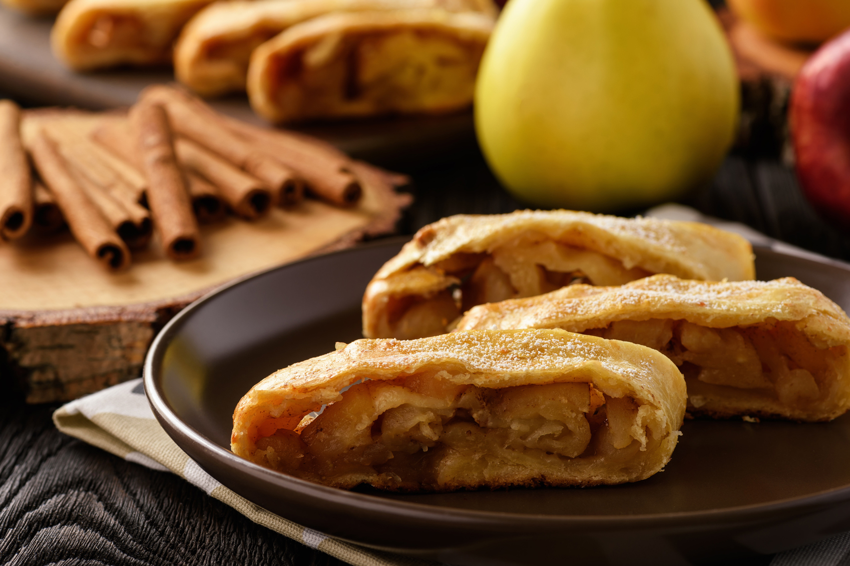 Apple Strudel Cinnamon Www.Istockphoto.Com Gb Photo Apple Strudel With Cinnamon On Wooden Background Gm636477754 112936077 Iko636
