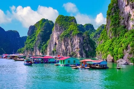 floating-village-rock-island-halong-bay-vietnam-690629572.jpeg