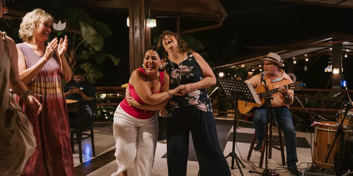 Group Of Women Laughing And Dancing