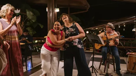 Group Of Women Laughing And Dancing