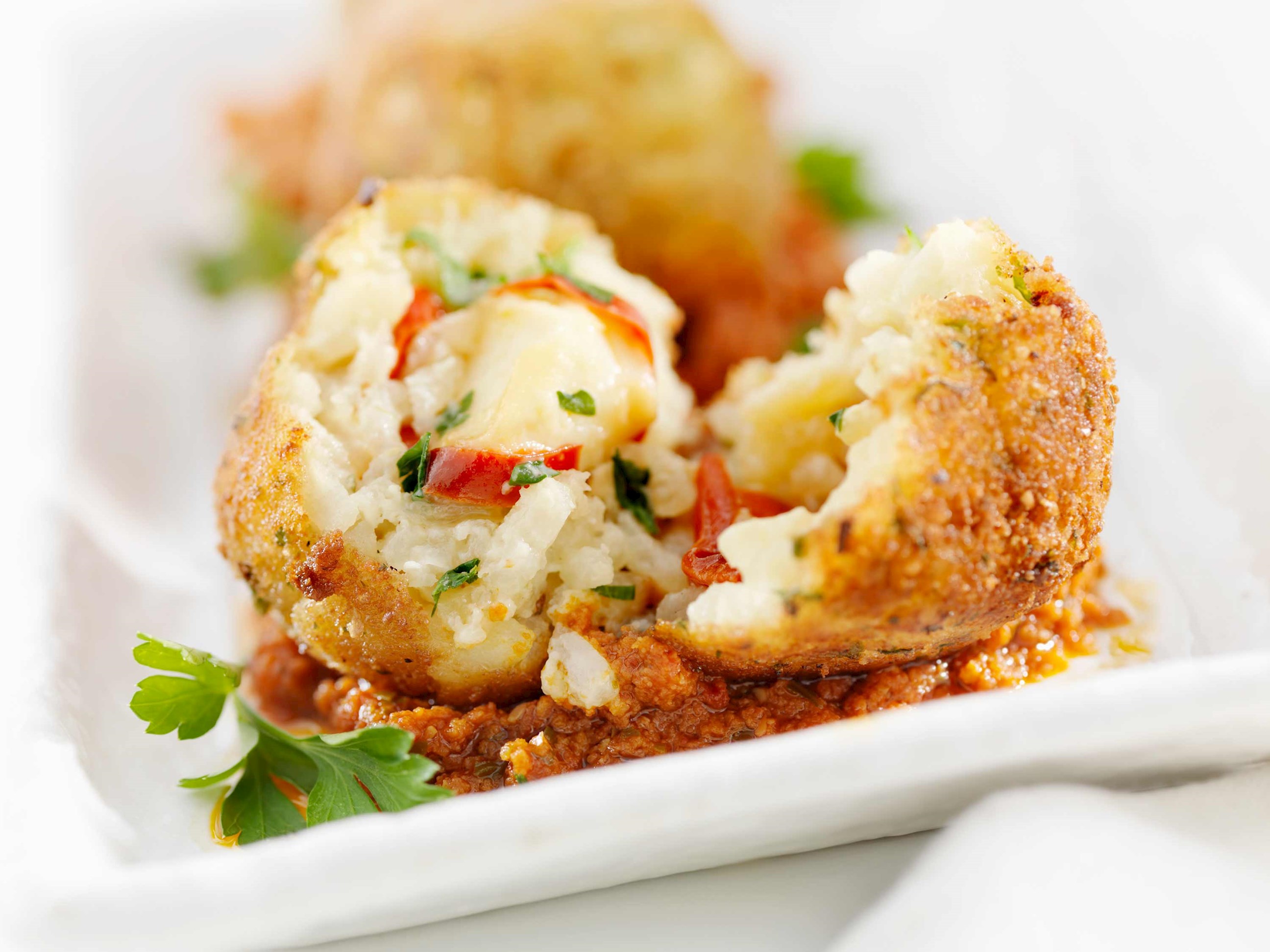 A close-up of a lobster arancini in Sicily, Italy