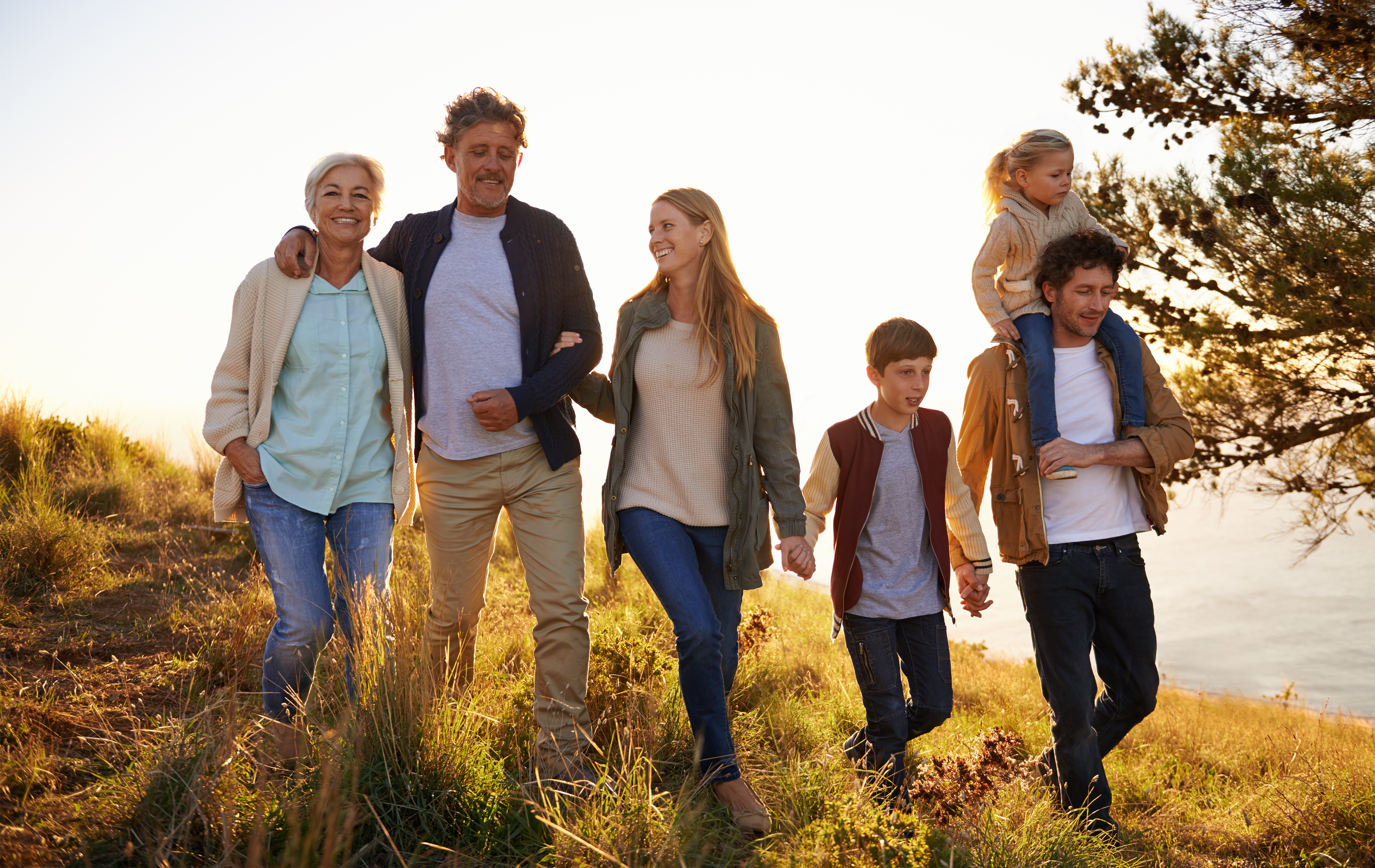 A family strolling across a seaside cliff