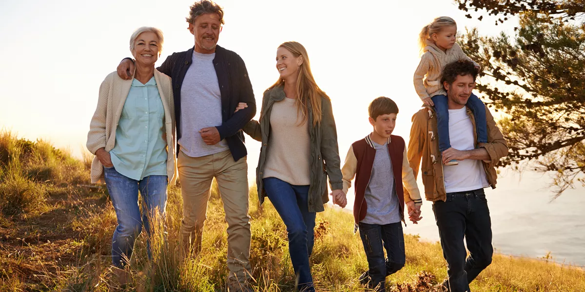 A family strolling across a seaside cliff