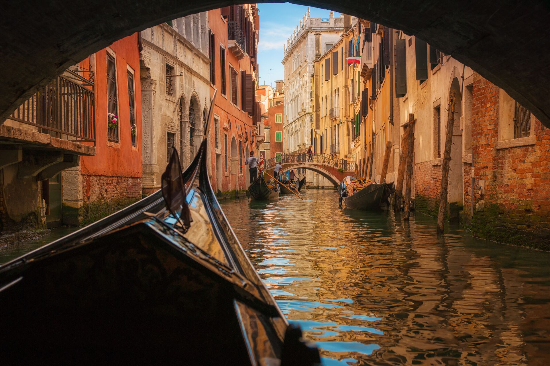 Gondola passing under a bridge in Venice, Italy