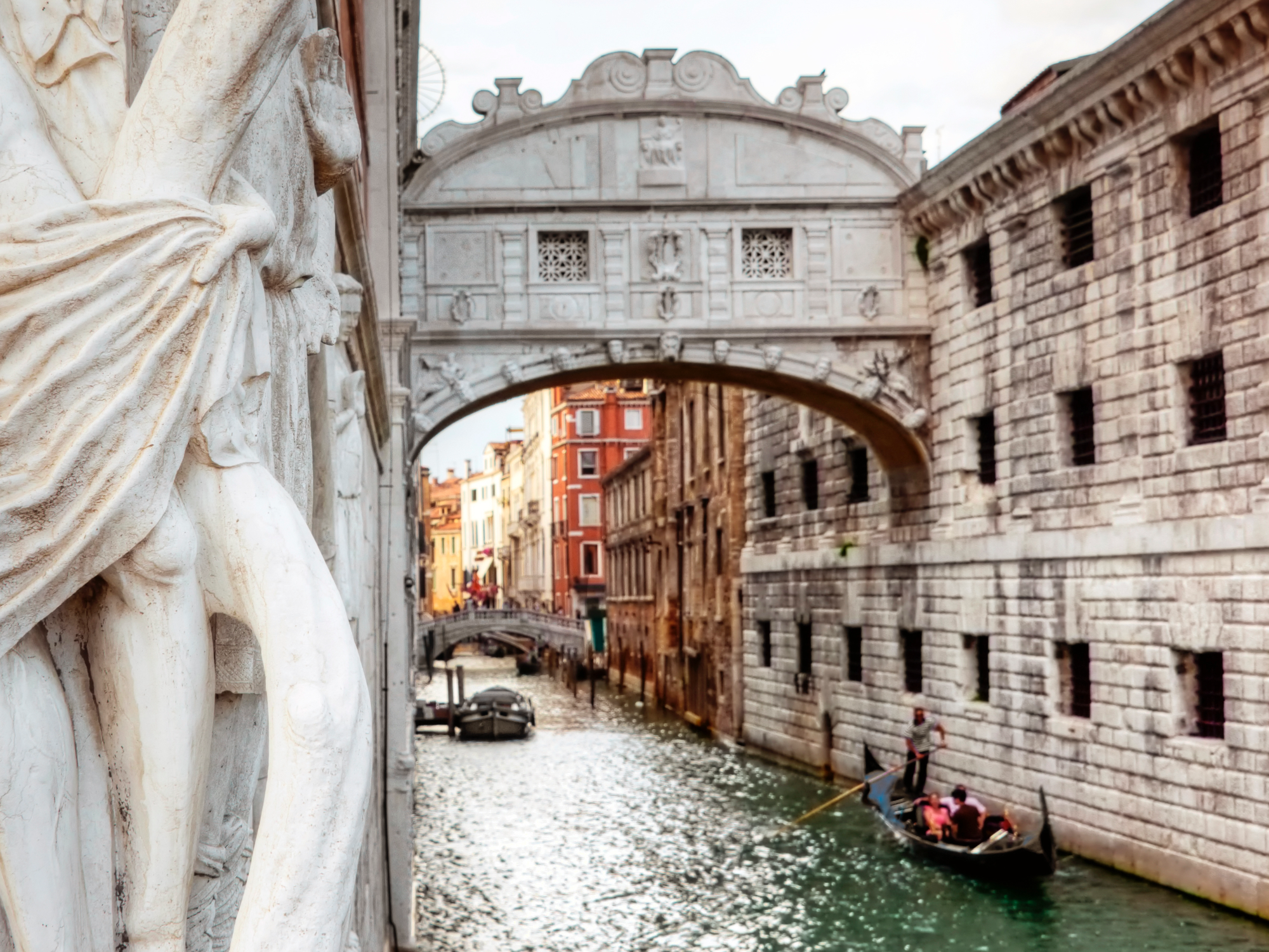 Gondols flowing through the canals of Venice