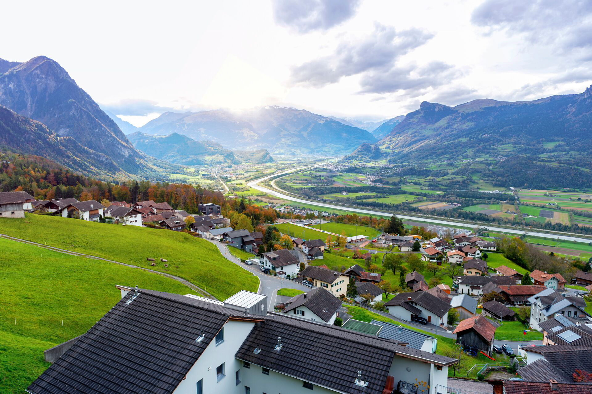 Scenic Aerial View Of Hillside Villages In Triesenberg And The River Rhine, Natural Border Of Liechtenstein, An Alpine Country In Central Europe