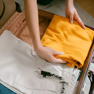 Woman packing a suitcase