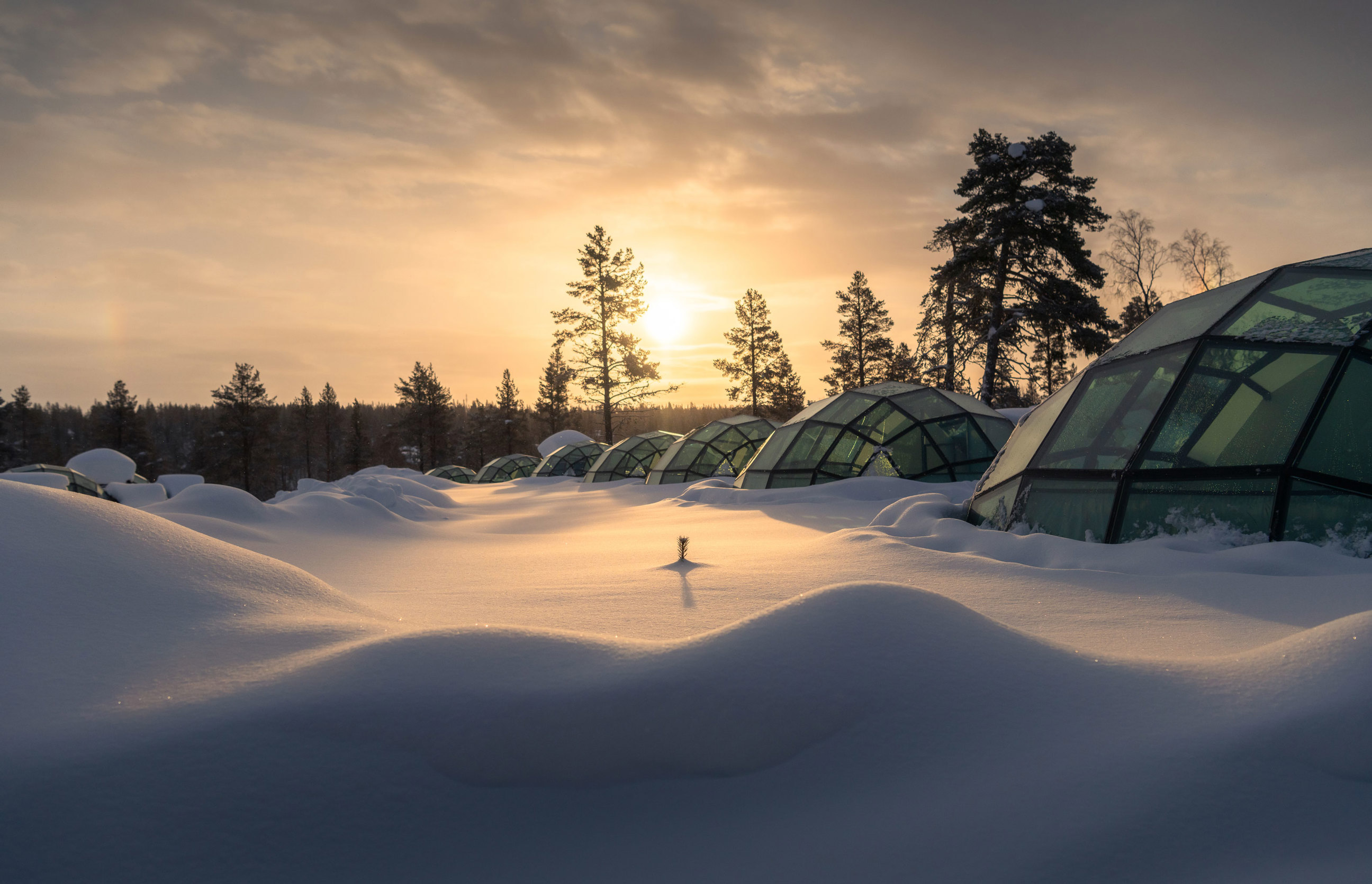 Sun is rising at the Glass Igloo, Kakslauttanen Arctic Resort West Village, Saariselkä, Lapland, Finland