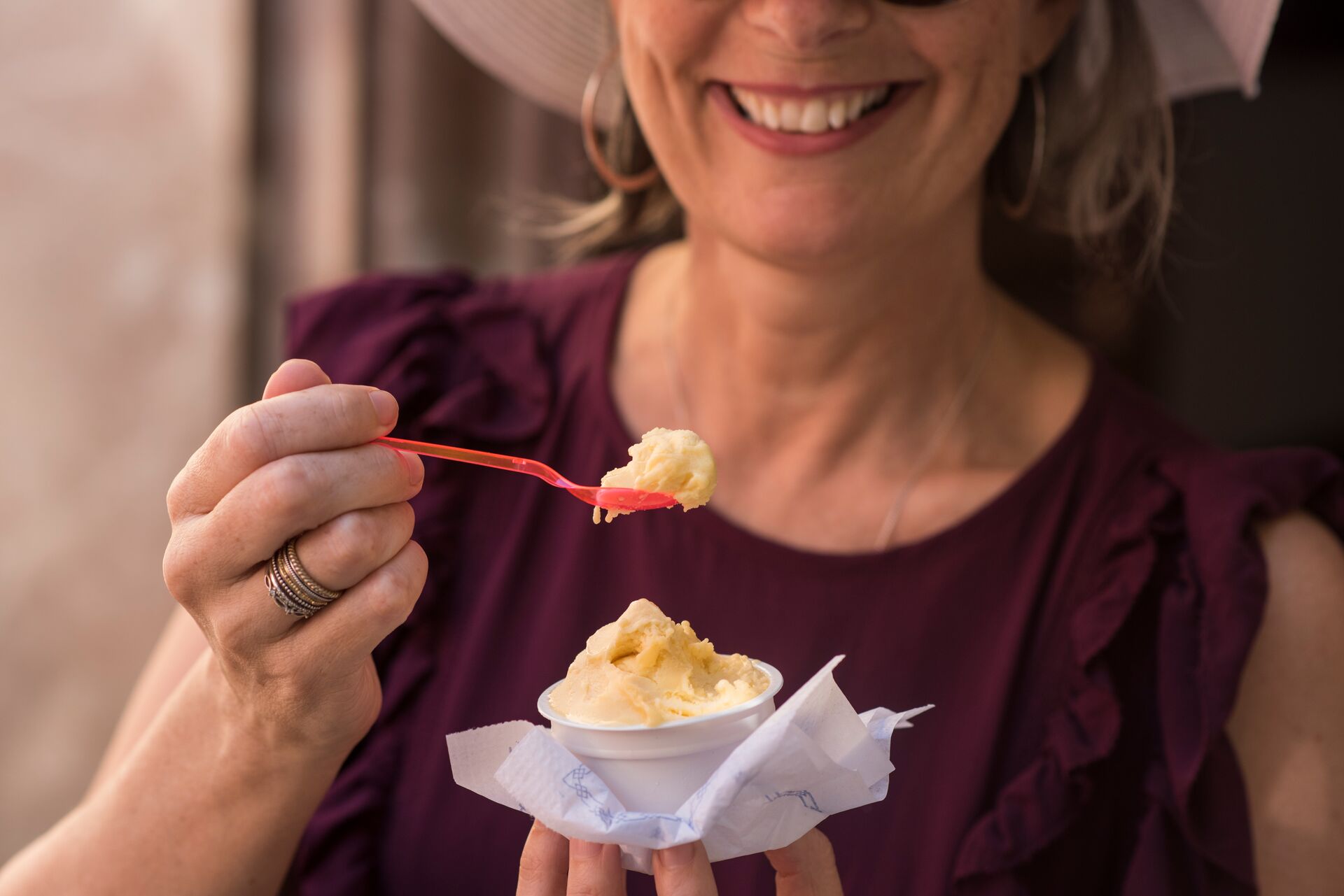 Close up image of a woman eating ice cream in Seville, Spain