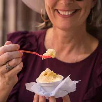 Close up image of a woman eating ice cream in Seville, Spain