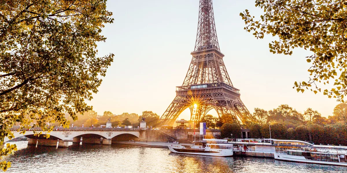 Large Eiffel Tower And Seine River At Sunrise