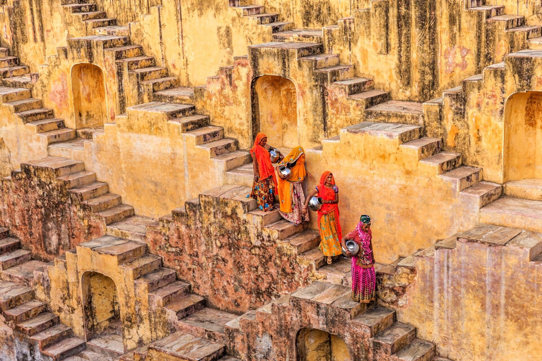 Large Indian Women Carrying Water From Stepwell Near Jaipur