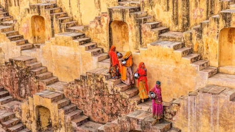 Large Indian Women Carrying Water From Stepwell Near Jaipur