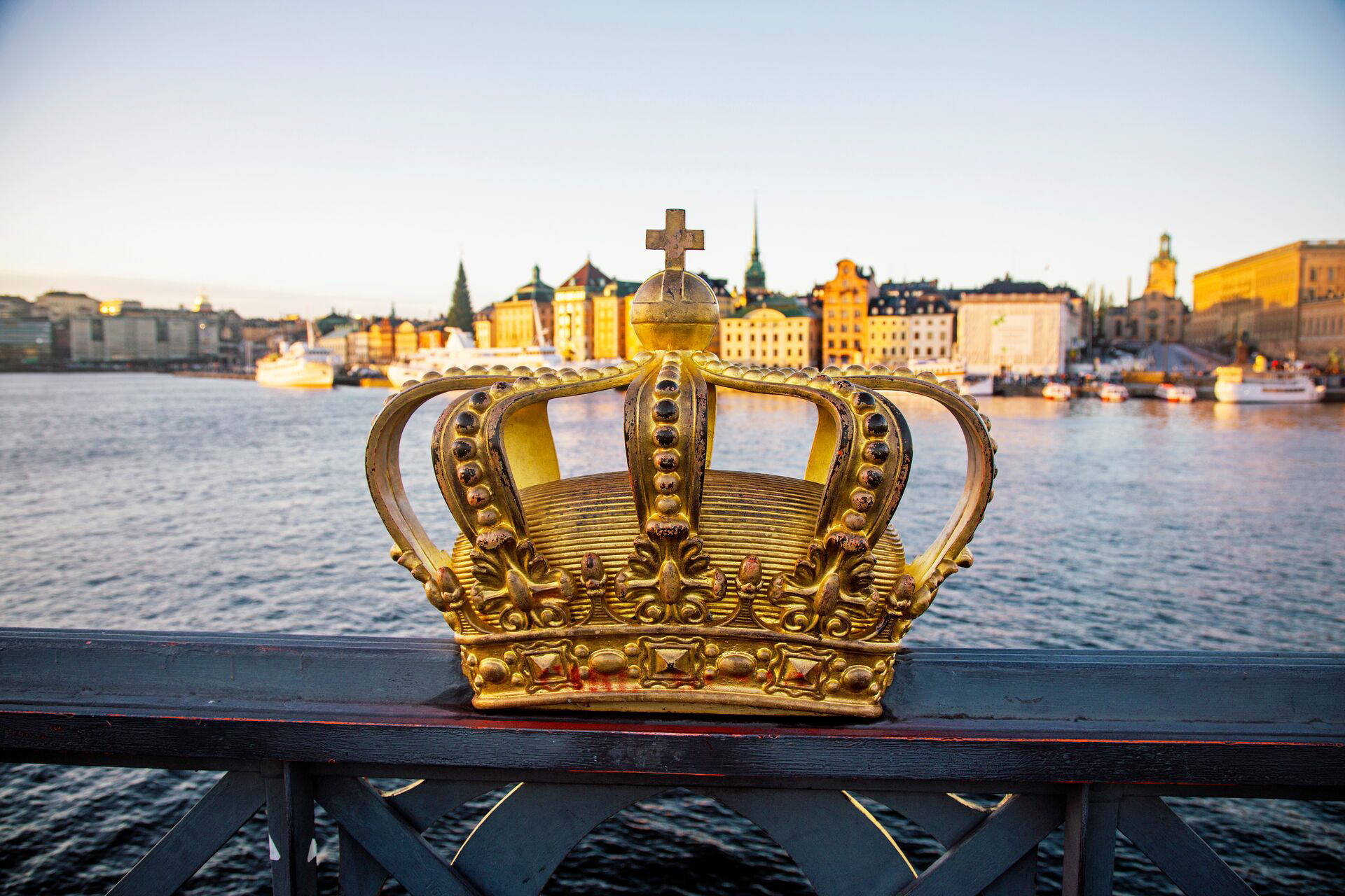 Skeppsholmsbron Bridge With Golden Crown In The Foreground, Stockholm, Sweden