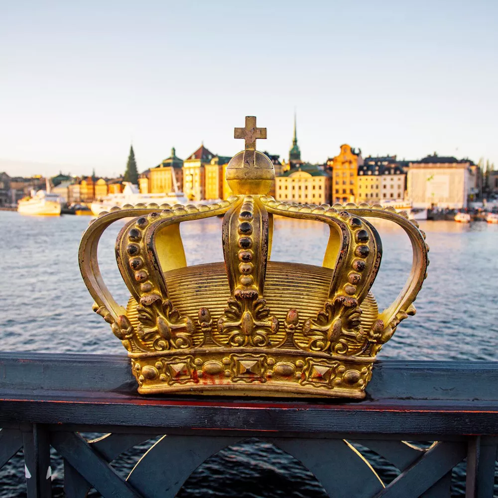 Skeppsholmsbron Bridge With Golden Crown In The Foreground, Stockholm, Sweden