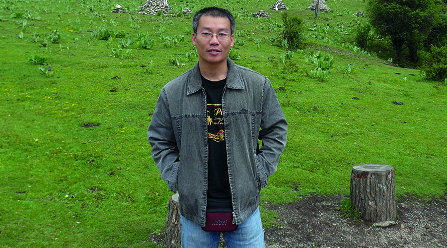 Travel Director Hubert stood in nature