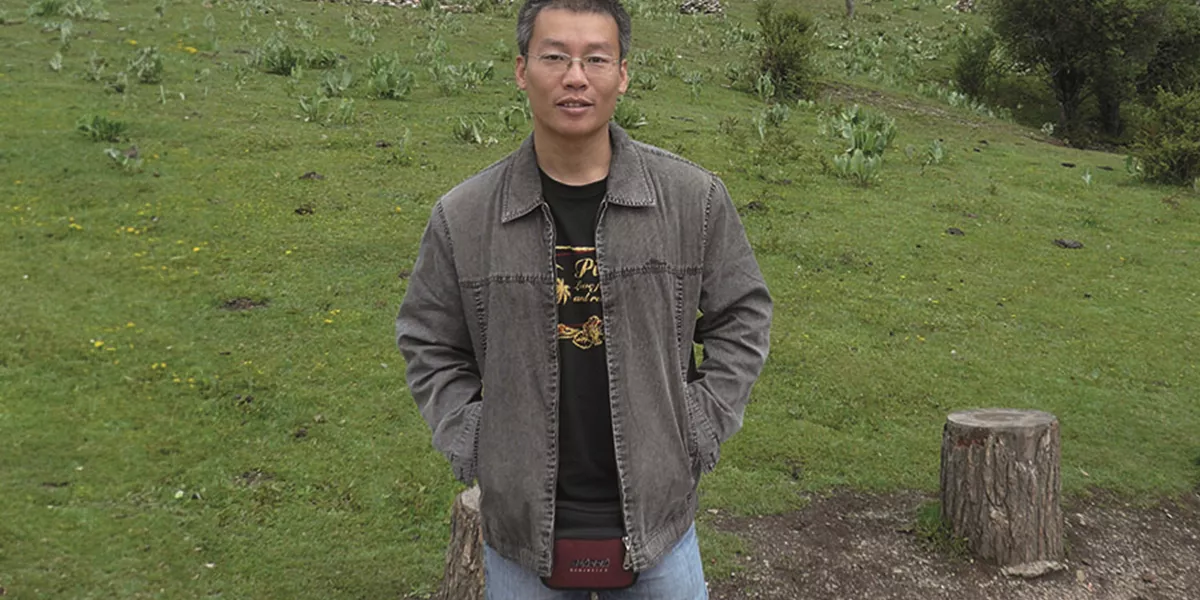 Travel Director Hubert stood in nature