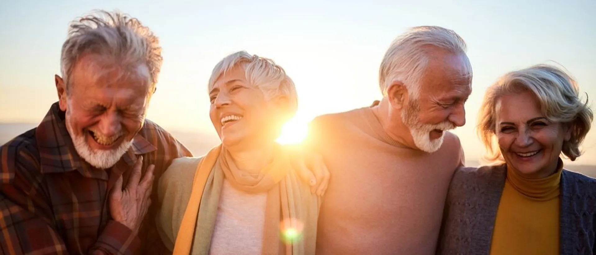 Happy Mature Couples Talking While Walking In Autumn Day