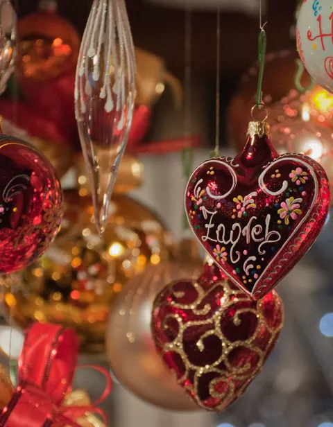 Christmas decorations hanging up in a stall at a Christmas Market