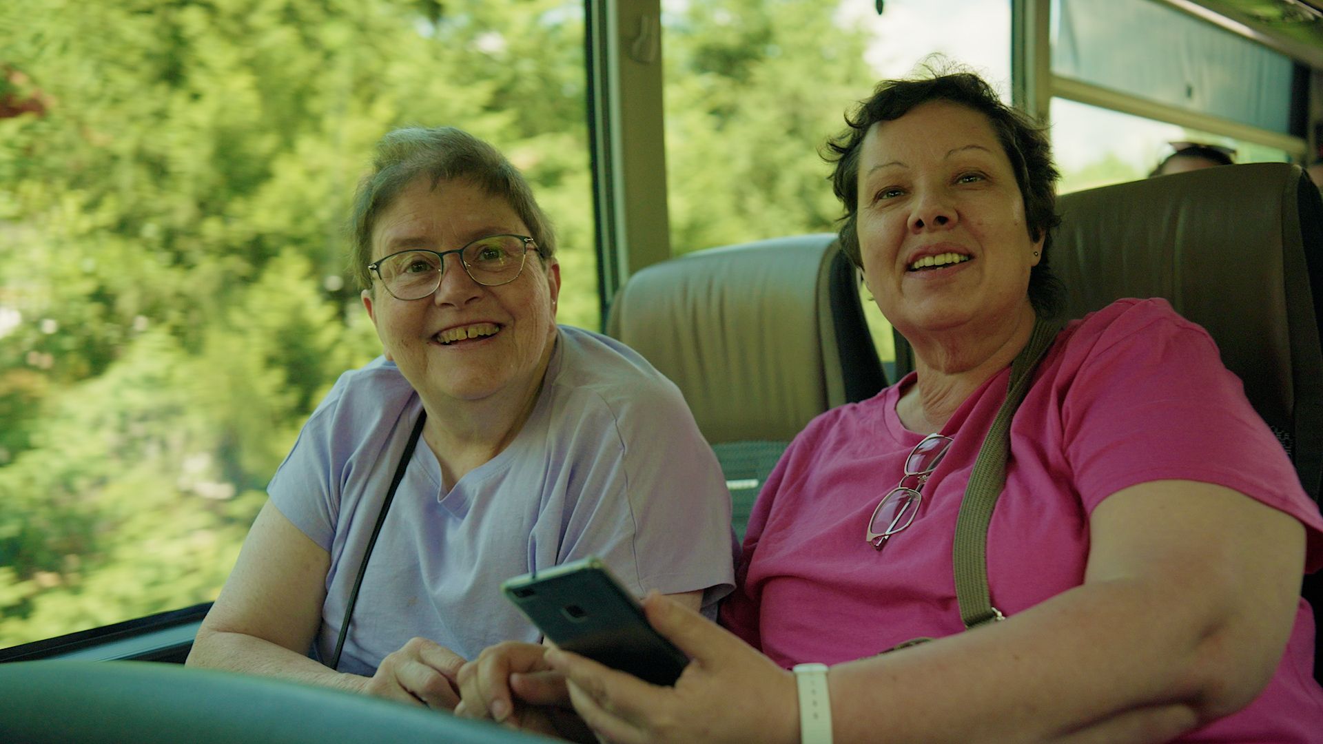 Two Smiling Women Travelling In Couch