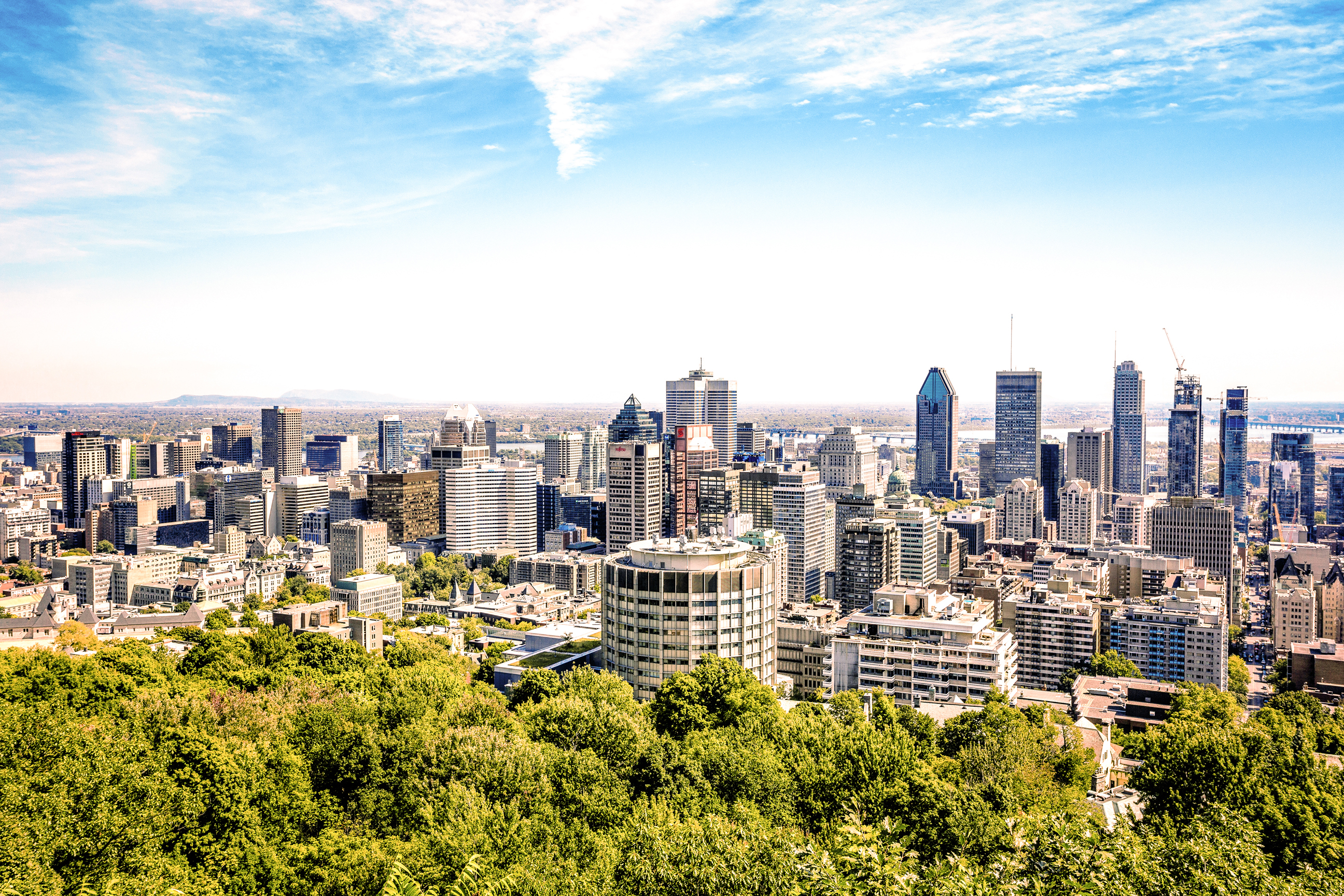 monteal-city-tour-montreal-downtown-cityscape-gettyimages-628464960-tt.jpg