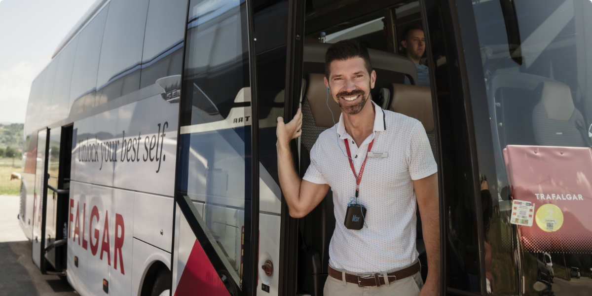 Travel Director standing on Trafalgar coach