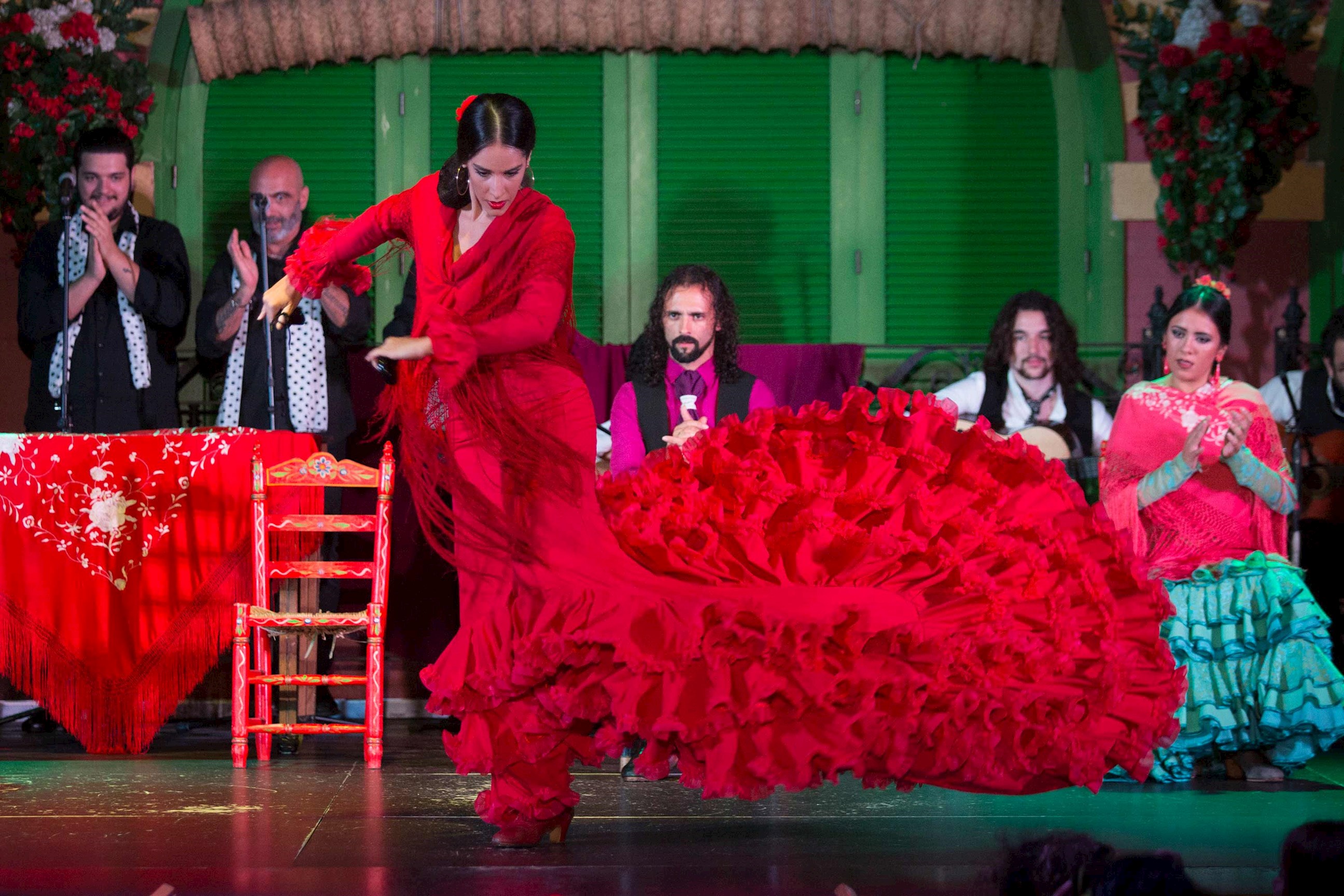 A group of people watching an Andalusian flamenco show 