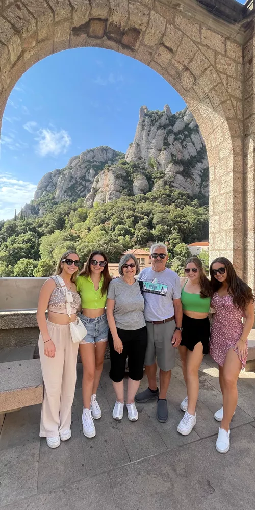 Family smiling for the camera while on holiday in Italy