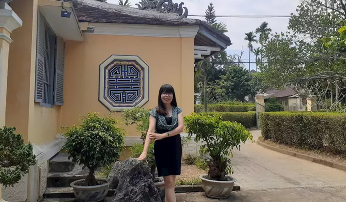 Woman in front of Lunch Garden House of Local Family Hue in Vietnam