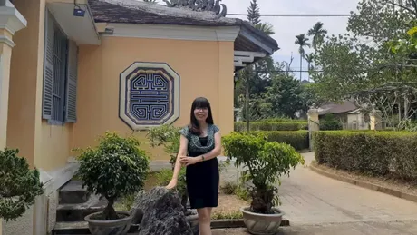 Woman in front of Lunch Garden House of Local Family Hue in Vietnam