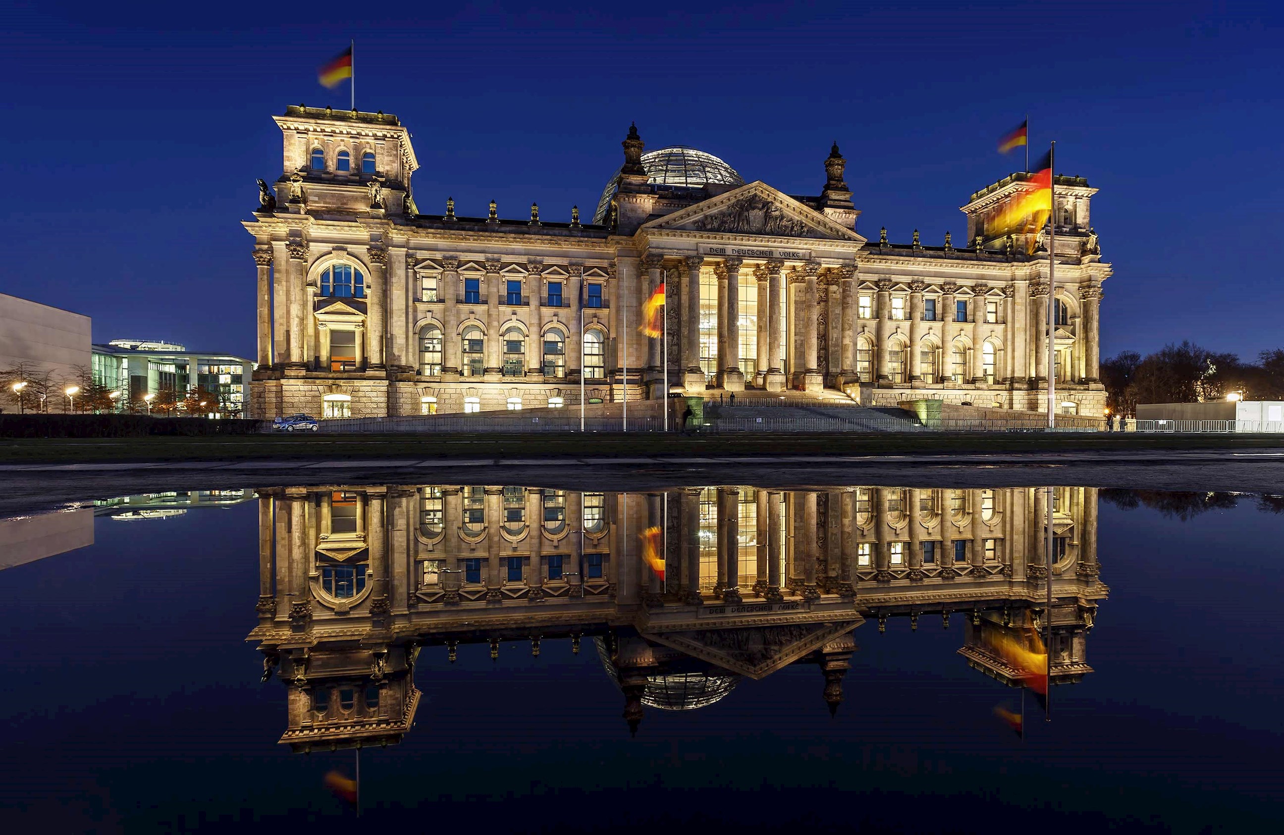 A nighttime view of the Reichstag Building in Berlin, Germany