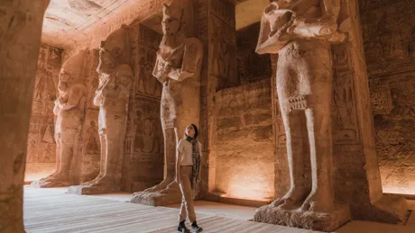 Woman walking inside Abu Simbel Temples