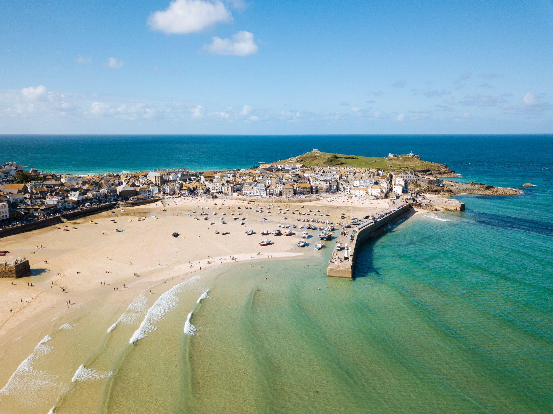 Aerial View Of St Ives A Wide Sandy Beach And Sheltered Harbour With Boats