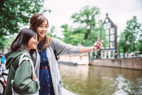 Mom Taking Selfie With Her Teenage Daughter