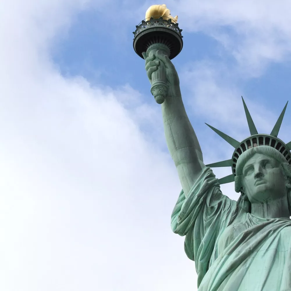 Low Angle View Of Historic Statue Of Liberty Against Sky