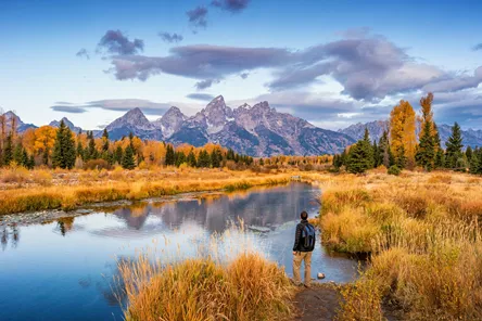 Hiker admiring the mountains in Grand Teton National Park in Wyoming, USA
