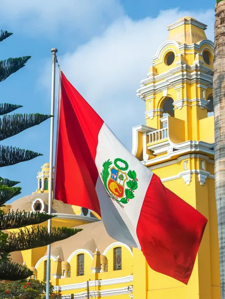 peru-flag-in-front-of-church-475480384.jpg