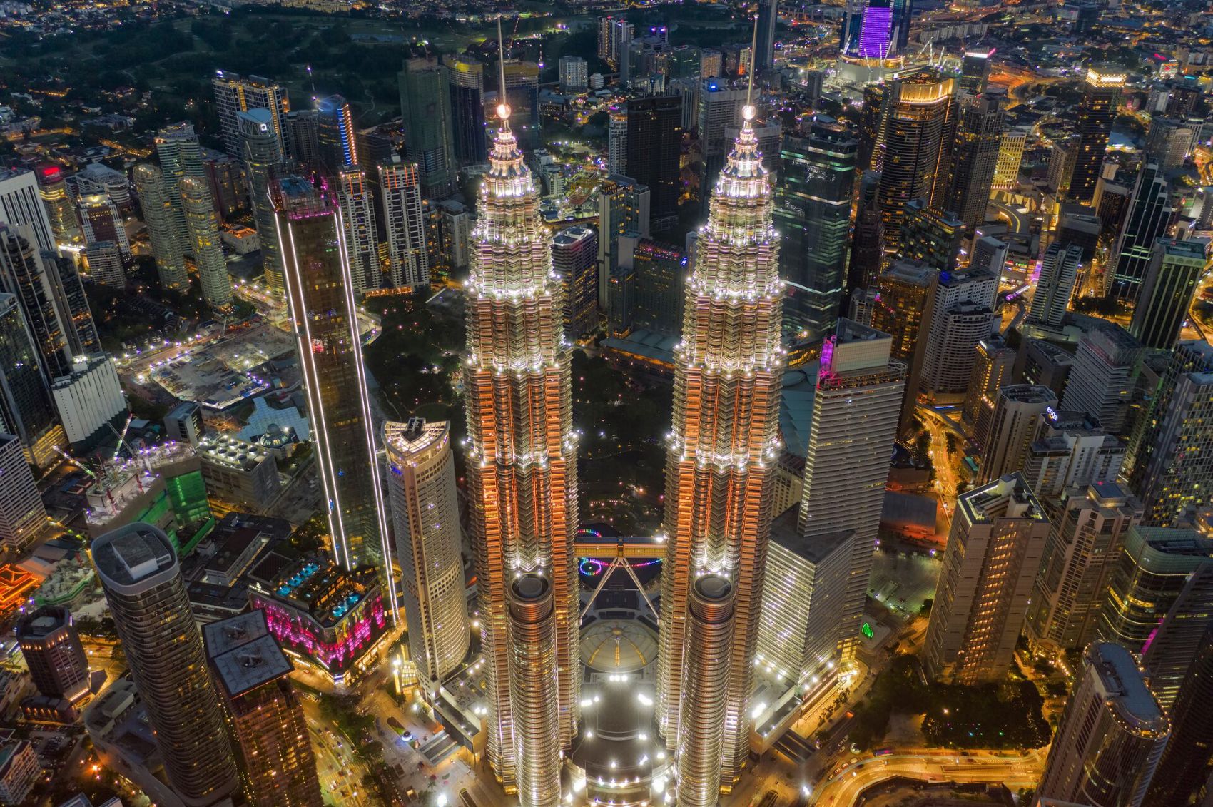Petronas Towers and city center at night in Kuala Lumpur, Malaysia