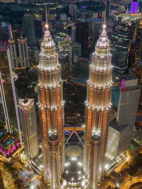 Petronas Towers and city center at night in Kuala Lumpur, Malaysia
