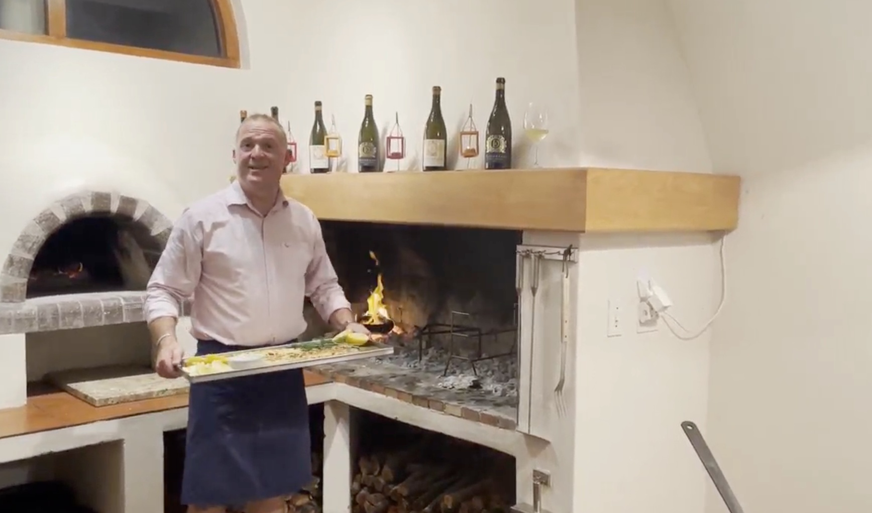 Chef Stefan from Hermanus Standing Next To Fireplace, South Africa