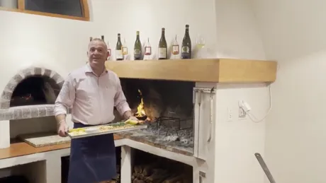 Chef Stefan from Hermanus Standing Next To Fireplace, South Africa